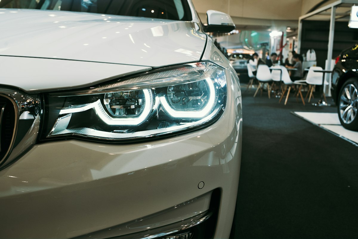 Close up of a white car on a showroom floor
