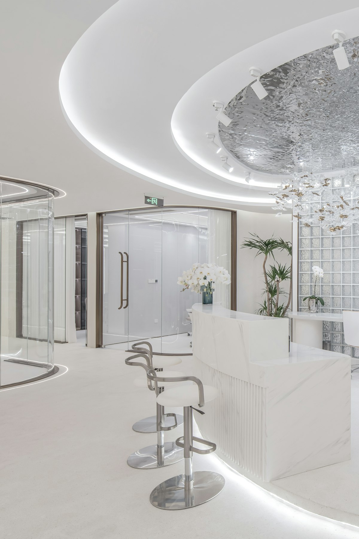 A bright modern clinic reception with curved white lines